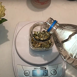 Adding distilled water to the chamomile