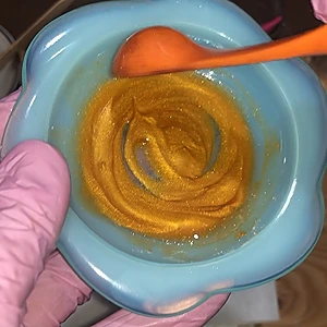 Preparing the mica color with a bit of almond oil