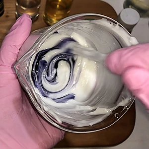 Pour the color mix into the lotion