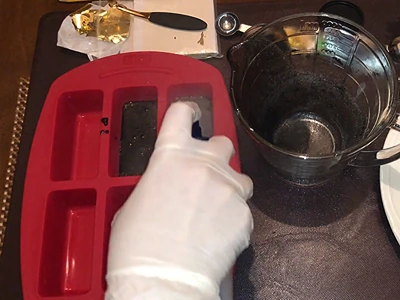 DIY Charcoal Soap - Spraying the mold with medical alcohol 70%