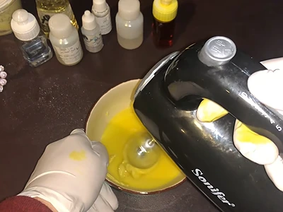DIY Lemon Body Butter - Using an electric hand mixer to mix the hardened contents