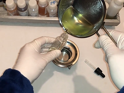 DIY Oil Primer - Pouring the finished product into a small serum bottle