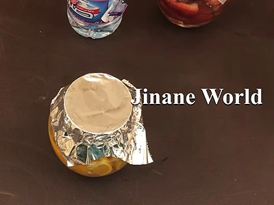 DIY Orange Extract for Skincare. Cover the container opening with aluminum foil and seal it