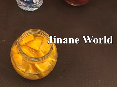 DIY Orange Extract for Skincare. The orange pieces are covered by the glycerine