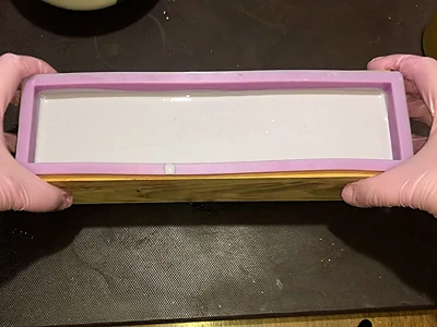 DIY Cold Process Lavender Soap. Gently tap the mold on the work table