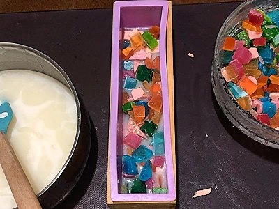DIY Glycerine Soap for Gifts. Distribute the colored shapes randomly in the first layer