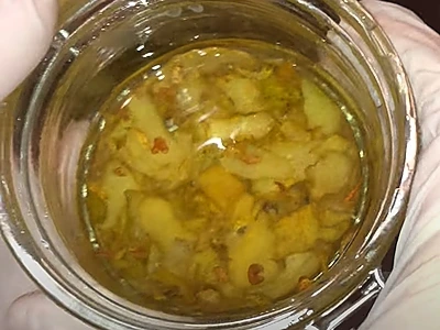 DIY Lemon Peel Carrier Oil. The oil and lemon peel after the bain-marie