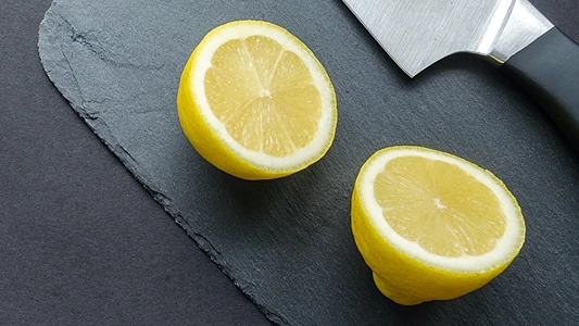 DIY Lemon Peel Carrier Oil. Lemon cut in half