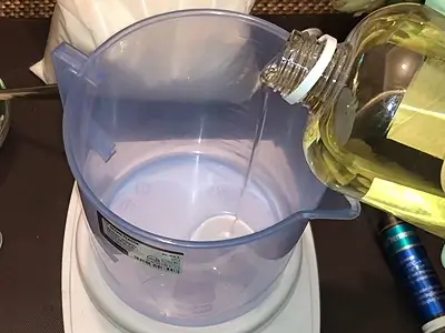 DIY Light Body Lotion. Pour sweet almond oil in a beaker