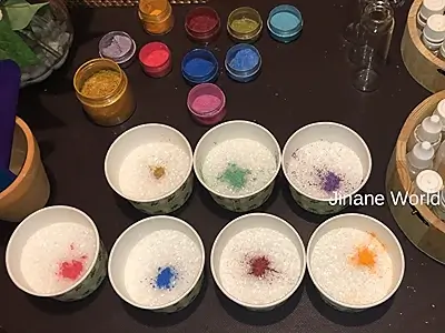 DIY Bath Salts for Cleansing and Relaxation. Seven bowls prepared, each with one color