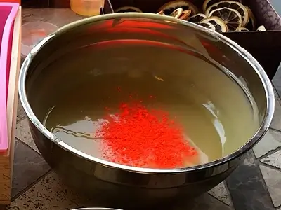 DIY Orange Cold Process Soap. Add some oily color powder, orange, in the second bowl