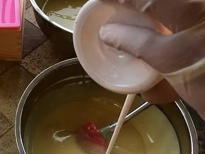 DIY Orange Cold Process Soap. Add some titanium dioxide to one bowl