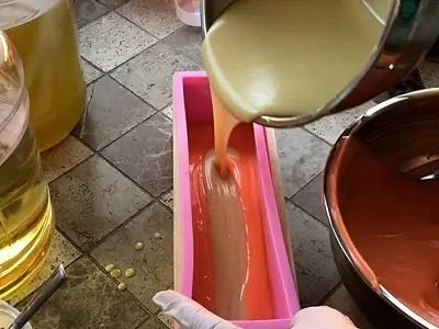 DIY Orange Cold Process Soap. Adding the second layer, whitish color