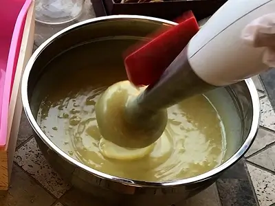 DIY Orange Cold Process Soap. The mixture has partially thickened