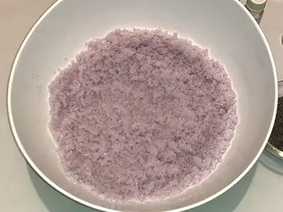 DIY Lavender Sugar Scrub Recipe. Purple mica color powder added and mixed