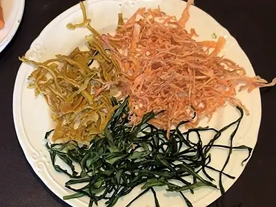 How to Make Dried Carrot Powder. Dried carrot skin and strips. On the plate, I also have dried cucumber and lemon