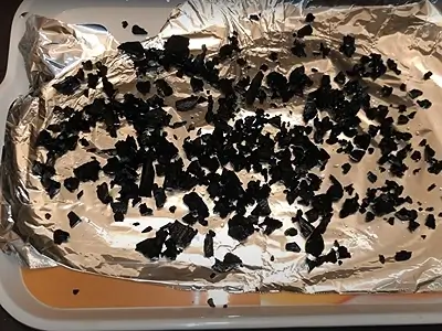 DIY Natural Activated Charcoal. Lay out the charcoal pieces on aluminum foil to dry